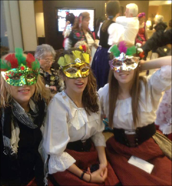Three Festa attendees modeling their mask creations (2013)